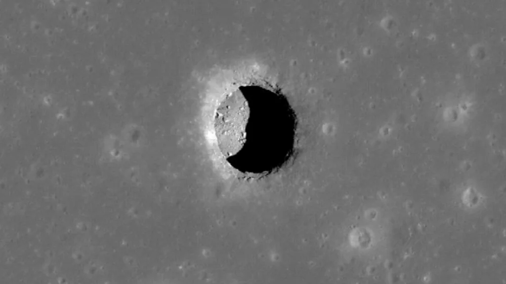 NASA's Lunar Tunnel Discovery: Moon Exploration and Planetary Science 1 A pit, leading to a cave, in the Mare Tranquillitatis region of the moon.